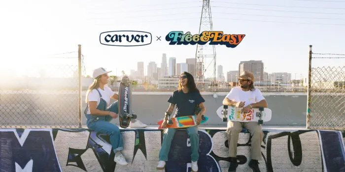 3 persons sitting holding a surfskate