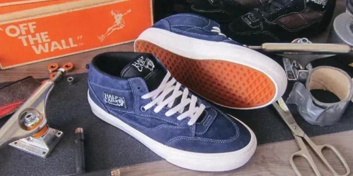 A pair of blue Vans Half Cabs